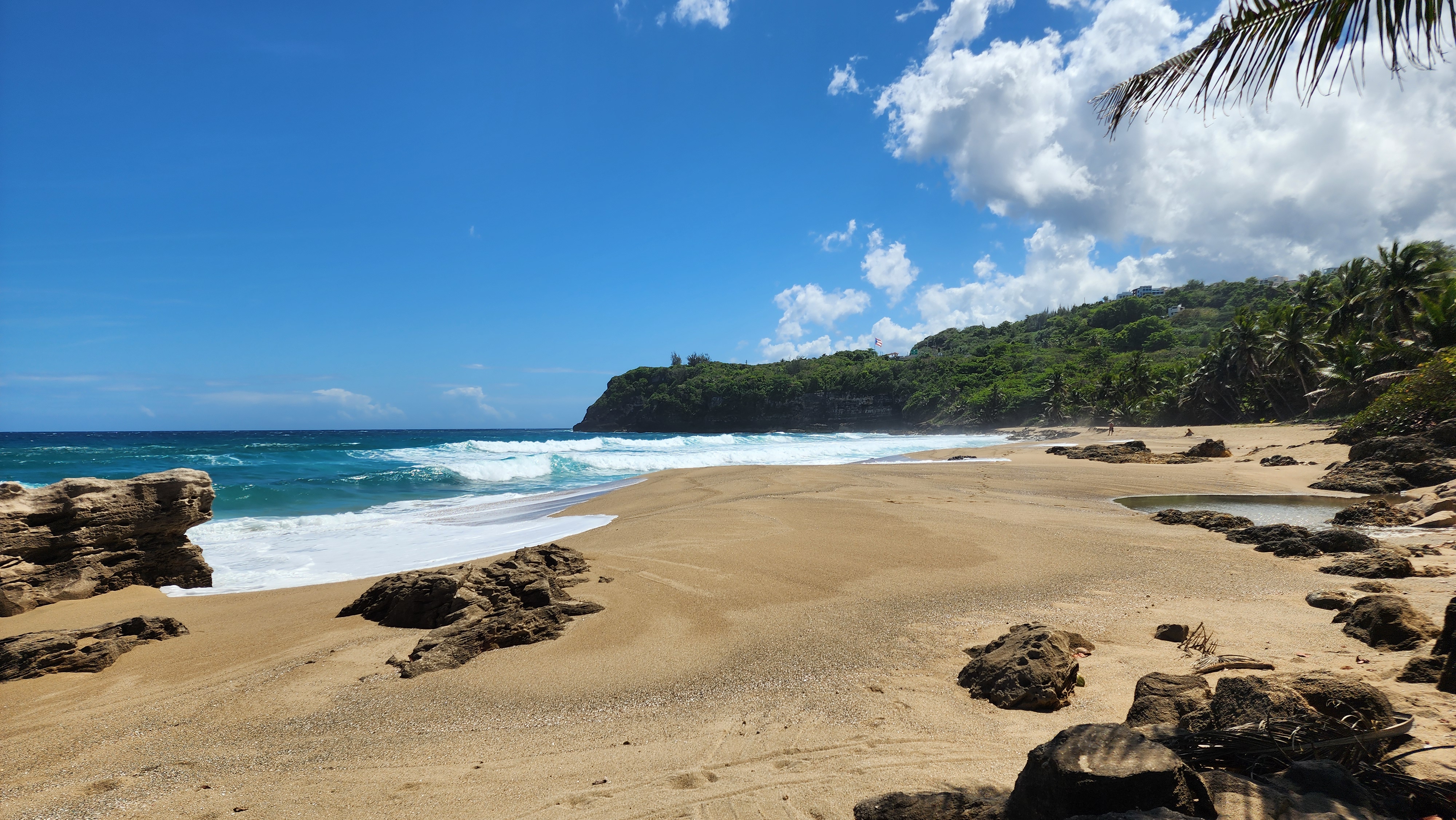Hidden crescent beach with turquoise water on Puerto Rico's north coast