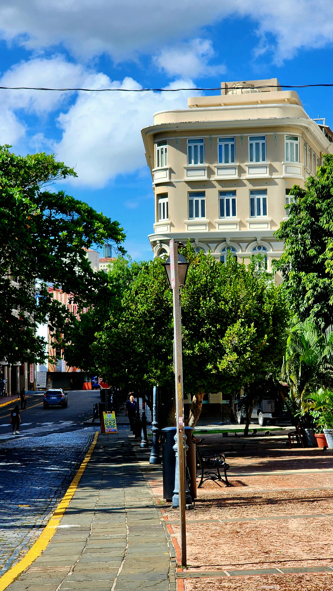 Historic corner building in Old San Juan under a bright Caribbean sky