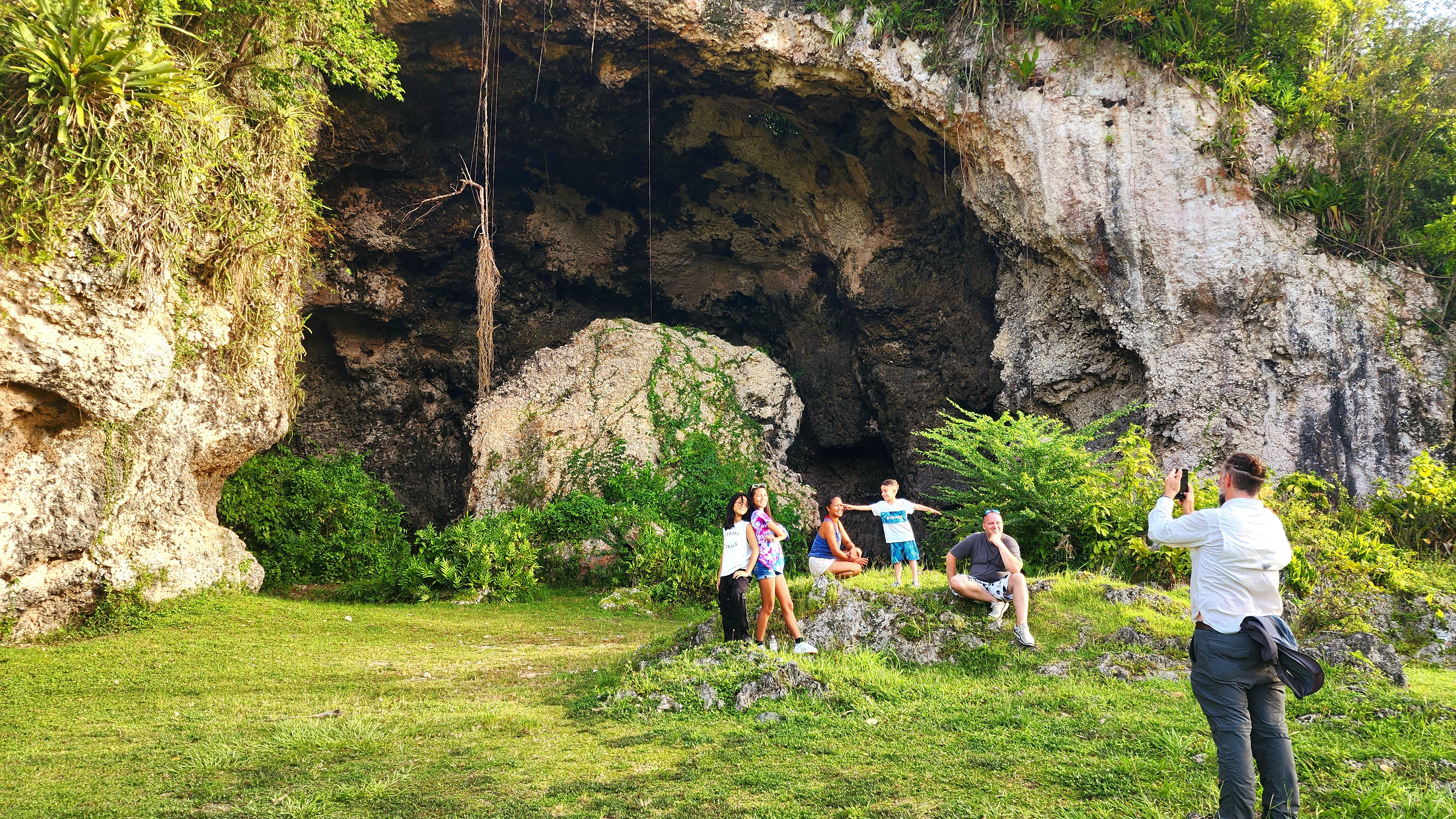 Interior of a majestic Puerto Rican limestone cave with a shaft of sunlight
