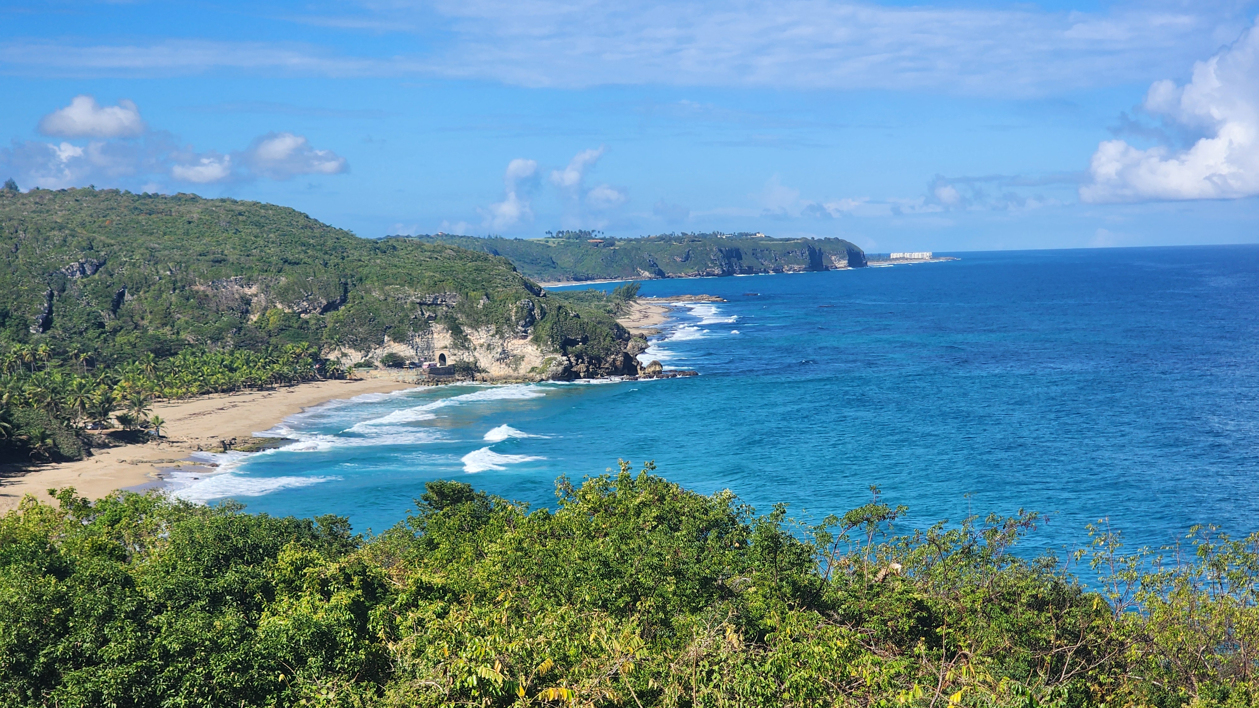 Charming historic Puerto Rican coastal town with colorful colonial buildings and ocean view