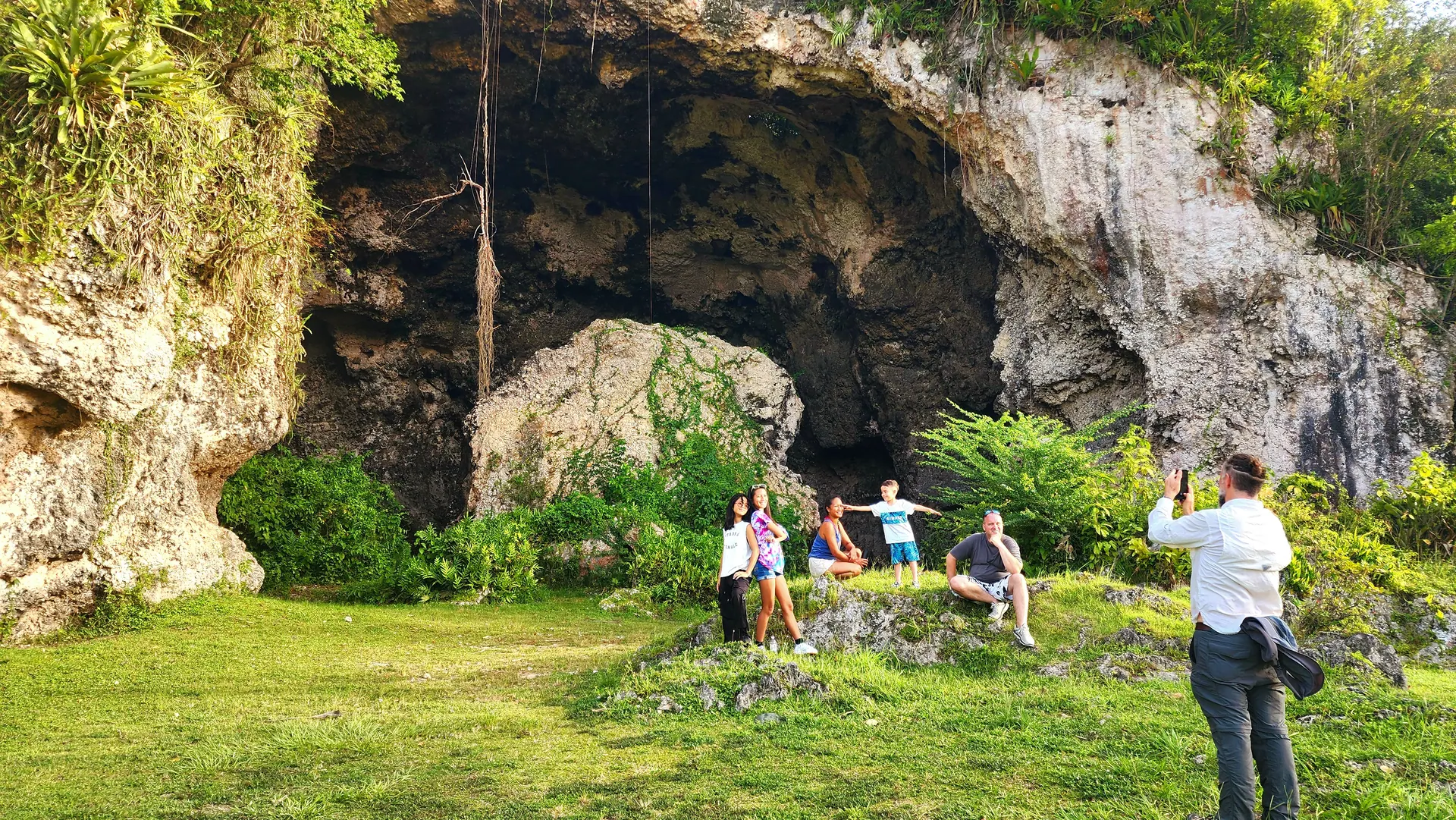 Interior of a majestic Puerto Rican limestone cave with a shaft of sunlight