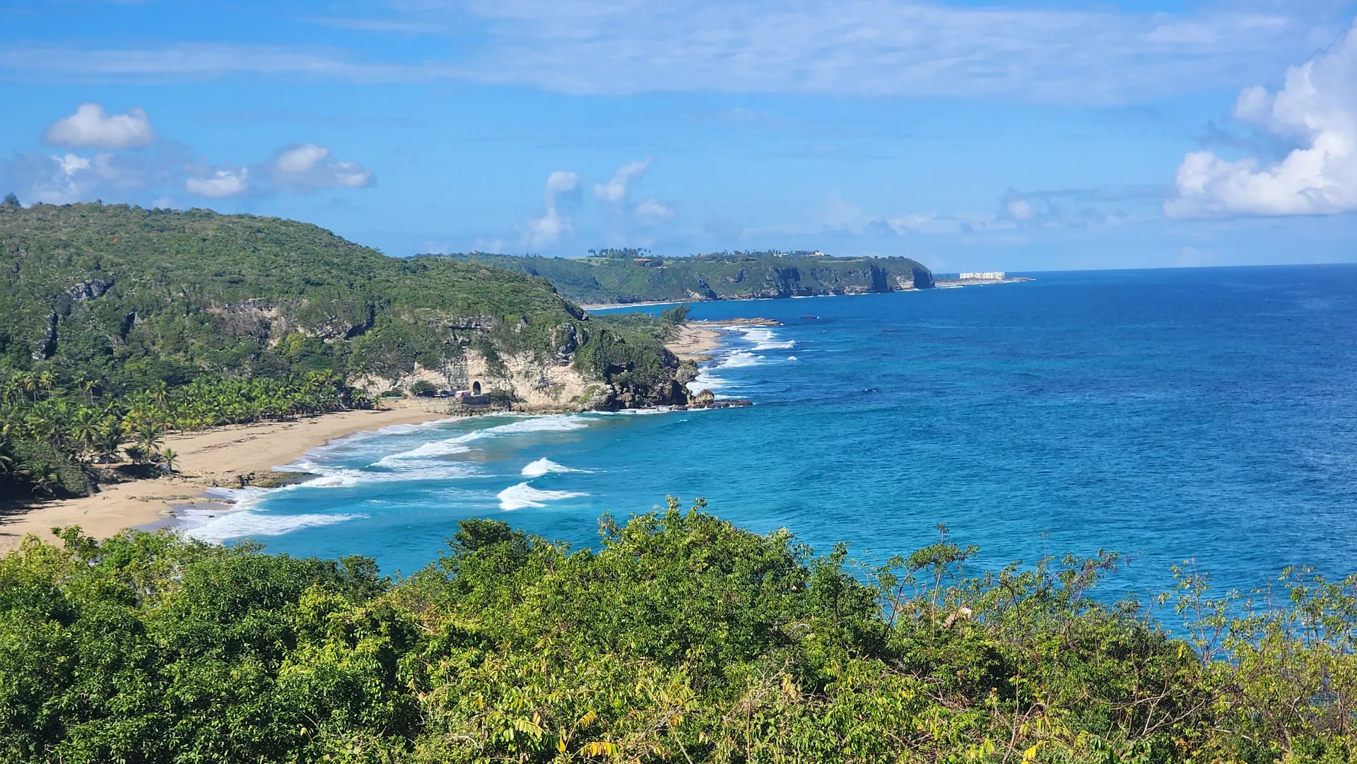Charming historic Puerto Rican coastal town with colorful colonial buildings and ocean view