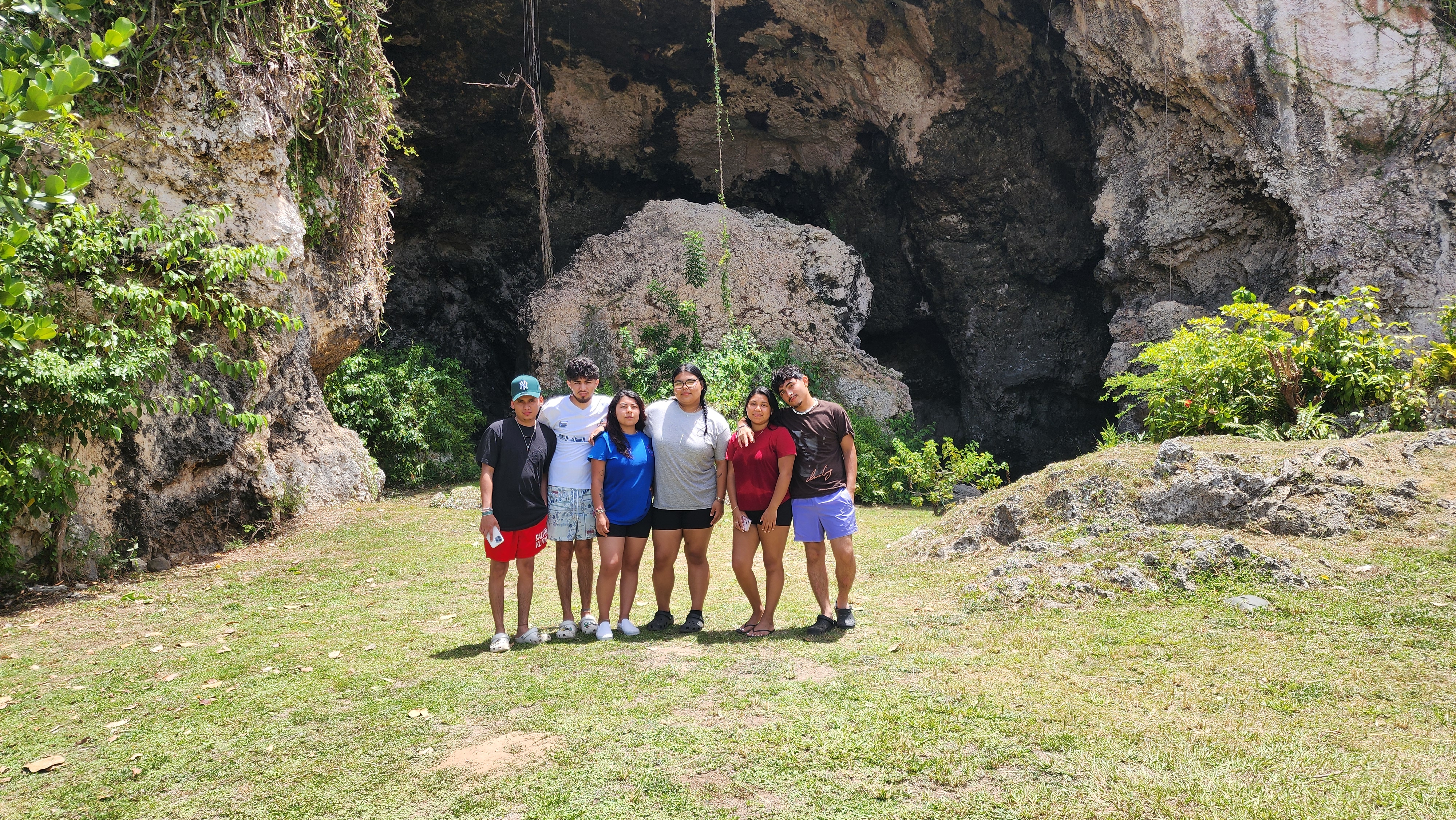 Interior of a majestic Puerto Rican limestone cave with a shaft of sunlight