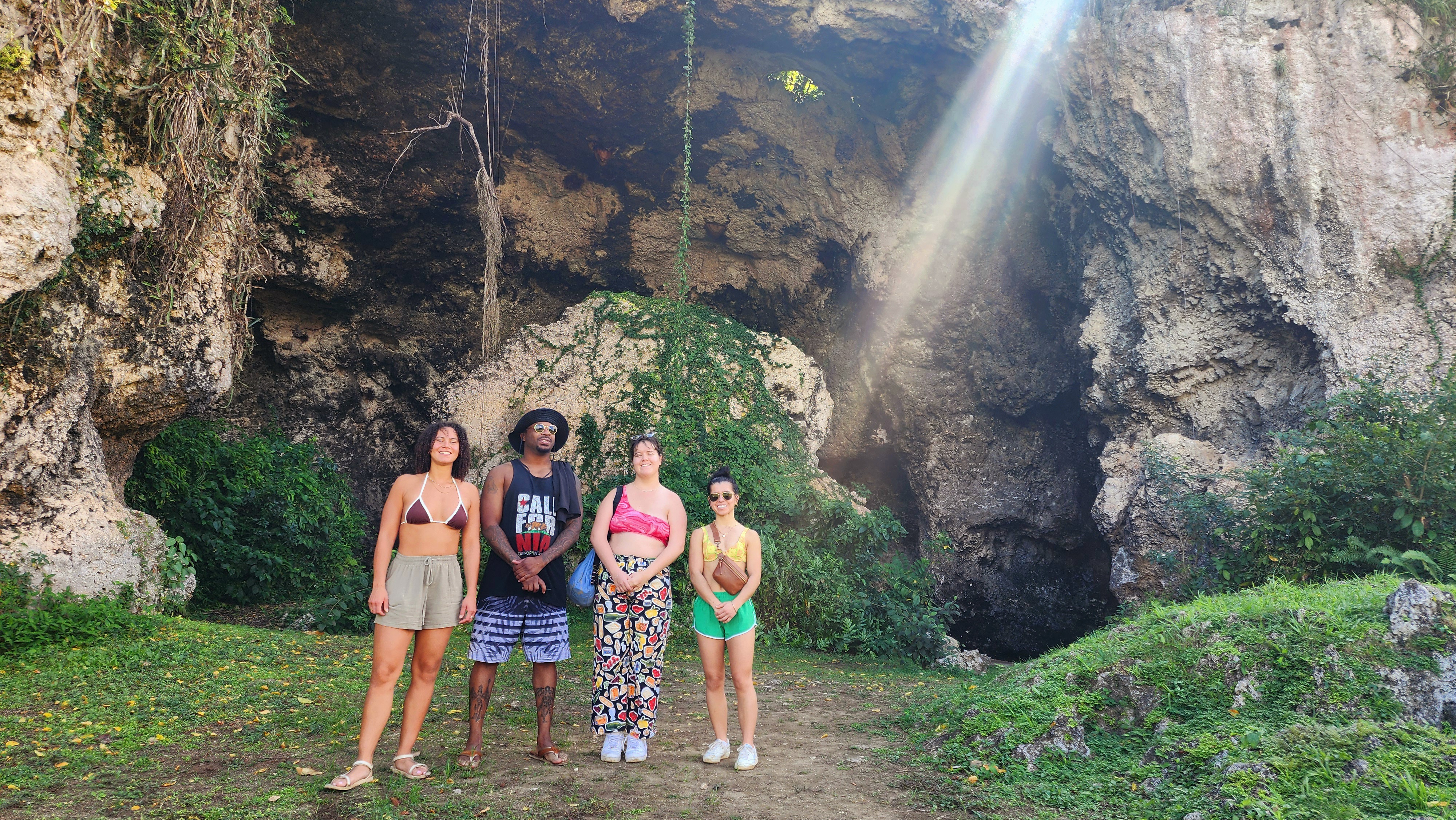 Interior of a majestic Puerto Rican limestone cave with a shaft of sunlight