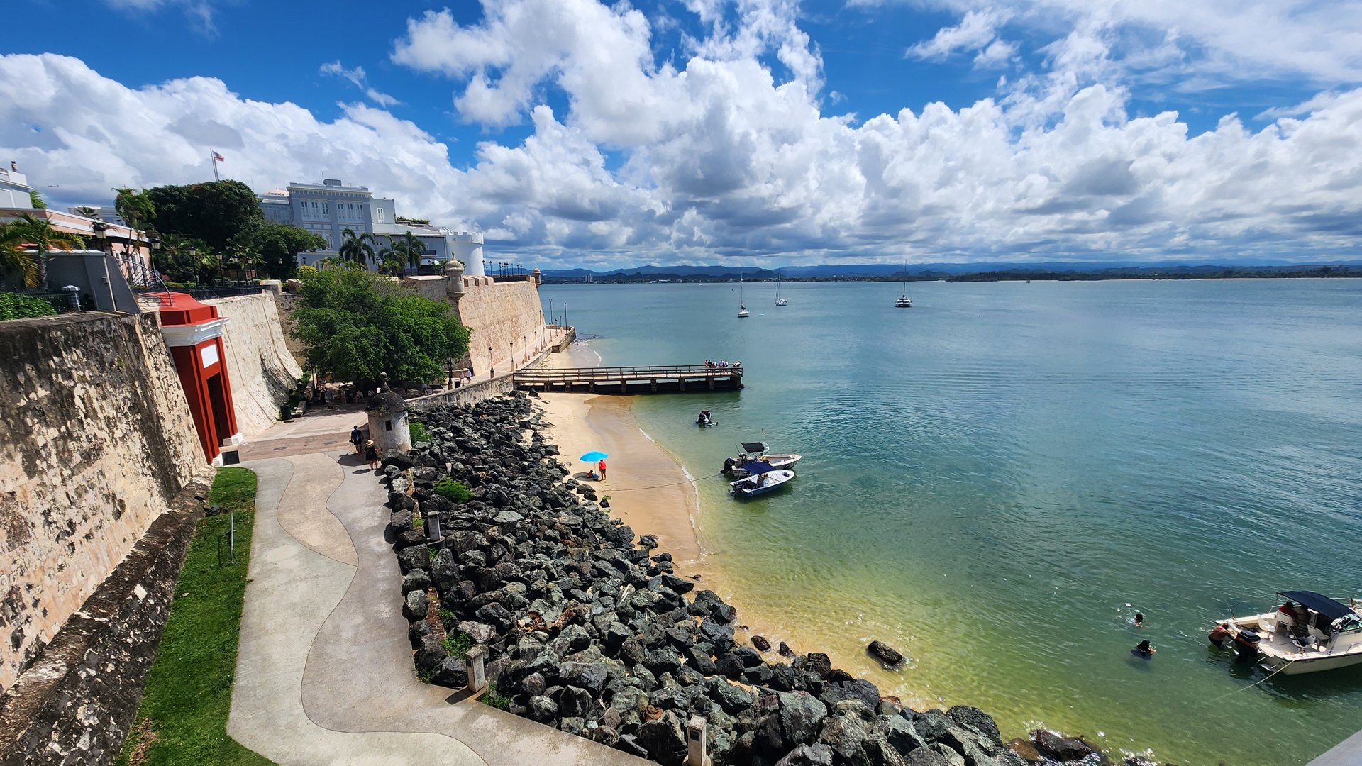 Small boats resting in the calm waters of the San Juan coastline