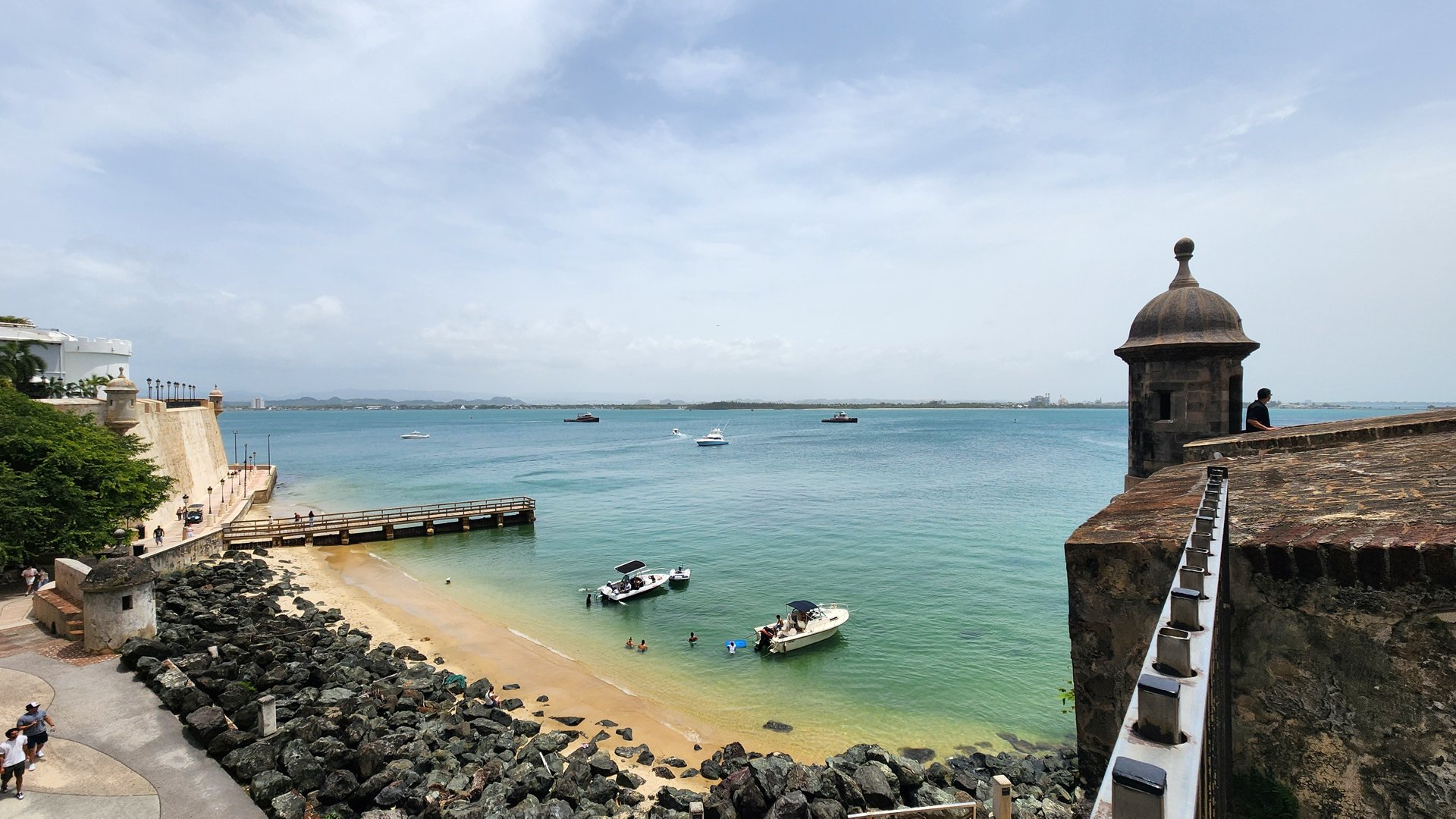 Sentry box overlooking a calm turquoise beach in San Juan